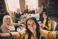 Self-portrait of nice attractive cheerful big full family brother sister gathering parents grandparents eating homemade