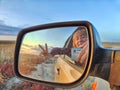 Self portrait at side view mirror of car in travel, trip on nature Royalty Free Stock Photo