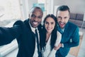 Self portrait of stylish successful, professional trio, afro-american black man with stubble shooting selfie with hand on smart p Royalty Free Stock Photo