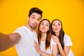 Self-portrait of three nice attractive lovely lovable charming cheerful cheery positive person sending you kiss having Royalty Free Stock Photo