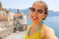 Self portrait of young smiling woman with sunglasses in Atrani village, Amalfi Coast, Italy. Royalty Free Stock Photo