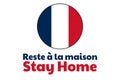 Self quarantine and and social distancing concept. Inscription Stay Home in French. Flag of France. COVID-19 coronavirus