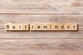 Self reminder word written on wood block. self reminder text on table, concept Royalty Free Stock Photo