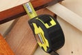 Self retracting tape measure