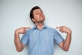 Self-satisfied and proud caucasian young man looks forward Royalty Free Stock Photo