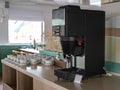Self-service area, coffee machine in the cafeteria. large coffee machine for self service in Buffet. Cups for coffee and tea at