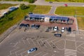 Self-service car wash. Cars are on the posts of a car wash. People wash their cars. An aerial shot