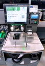 A self-service checkout kiosk in a Walmart Superstore