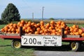 Self-service farm pumpkin wagon two dollars each. Royalty Free Stock Photo