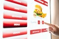 Self service order kiosk and digital menu in fast food burger restaurant. Touch screen in vending machine.