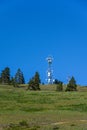 Self-supporting tower loaded with wireless communications antennas on a hilltop in Kittitas County, Eastern Washington State