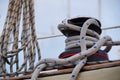 A self-tailing winch of a sailing boat with rope over it. Royalty Free Stock Photo