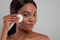 Selfcare. Attractive Black Woman With Beautiful Skin Cleansing Face With Cotton Pad,