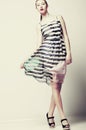 Selfhood. Funky Woman wearing Stylish light Fluttering Dress