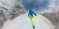 SELFIE Athletic male tourist shreds the fresh powder snow while skiing off piste Royalty Free Stock Photo