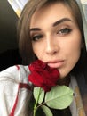 Selfie beautiful young girl with Rose