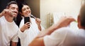 Selfie, brushing teeth and couple in a bathroom, mirror and happiness with hygiene, home and wellness. Partners, man or