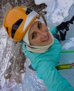 SELFIE: Cheerful woman takes a selfie while ice climbing in the Julian Alps. Royalty Free Stock Photo