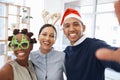 Selfie, christmas and a friends at an office party together at an end of year function for celebration. Portrait, smile