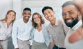 Selfie, collaboration and diversity with a business team posing for a photograph together in their office. Portrait Royalty Free Stock Photo
