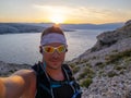 Selfie of cool trailrunning man in croatia on the island krk in baska in summer