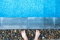 Selfie the feet at the pool side or edge with blue mosaic tiles Royalty Free Stock Photo