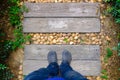 Selfie Foots standing on a wooden floor garden walkway