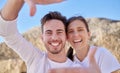 Selfie, frame hands and couple in nature for travel, adventure and smile against the mountain in Spain. Summer, happy Royalty Free Stock Photo
