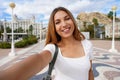 Selfie girl in Alicante, Spain. Self portrait of young woman with Casa Carbonell and Mount Benacantil with Santa Barbara castle on Royalty Free Stock Photo