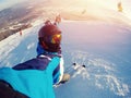 Selfie Guy sportsman goes on normal skiing on ski slope with action camera Sheregesh Royalty Free Stock Photo