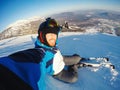 Selfie Guy sportsman goes on normal skiing on ski slope with action camera Sheregesh Royalty Free Stock Photo