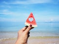 Selfie hand holding watermelon over summer beach background Royalty Free Stock Photo