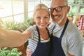 Selfie of middle aged caucasian couple in garden house Royalty Free Stock Photo