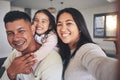 Selfie, happy and portrait of a family with a smile bonding in the living room of their home. Together, love and young Royalty Free Stock Photo