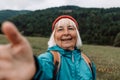 Senior woman traveler taking selfie in mountains Travel Lifestyle adventure concept active vacations outdoor Royalty Free Stock Photo