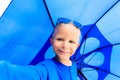 Selfie of little boy with umbrella on rainy summer Royalty Free Stock Photo