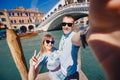 Selfie lover couple taking photo travel Venice, Italy against backdrop great canal and bridge Royalty Free Stock Photo