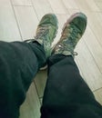 Selfie of a man's feet in a pair of green sneakers Royalty Free Stock Photo