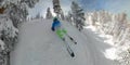 SELFIE: Man on skis speeds through the idyllic wintry woods in Park City, Utah. Royalty Free Stock Photo