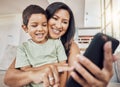 Selfie, mother and son phone in living room on sofa smile, together and happiness on smartphone. Happy mom, boy child or Royalty Free Stock Photo