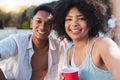 Selfie, party and summer with a black couple having fun outdoor while drinking at a celebration event. Love, alcohol and