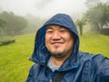 Selfie Photo of Asian fat trekker trekking to Khao Luang mountain Ramkhamhaeng National Park in rainy and foggy day Royalty Free Stock Photo