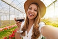Selfie photo of attractive young woman outdoors holding glass drinking wine on weekend activity Royalty Free Stock Photo
