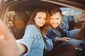 Selfie photo of young family with dog retriever Labrador in car. Concept summer trip travel Royalty Free Stock Photo