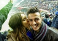 Selfie portrait of young couple watching sport soccer match in football italian stadium - Young people having fun together - Love Royalty Free Stock Photo