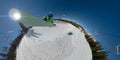 SELFIE: Pro male snowboarder catches big air while doing tricks in a halfpipe Royalty Free Stock Photo