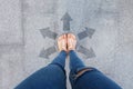 Selfie Shoes with Direction Arrows Choices. Woman Feet and Sandal Standing on Concrete Road Background