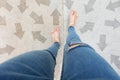 Selfie Shoes with Direction Arrows Choices. Woman Feet and Sandal Standing on Concrete Road Background