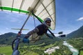 Selfie shot of brave extreme hang glider pilot soaring the therm