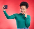 Selfie, smile and black woman in studio for profile picture, post or message on red background. Happy, photo and African